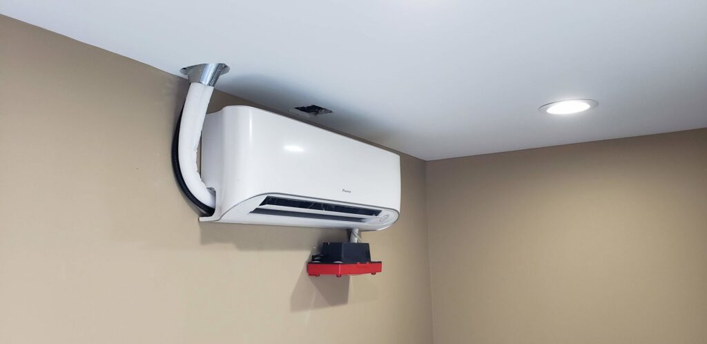 An indoor mini-split air conditioning unit installed on a wall by Brisk Air Inc in Phoenix, AZ.