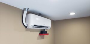 An indoor mini-split air conditioning unit installed on a wall by Brisk Air Inc in Phoenix, AZ.
