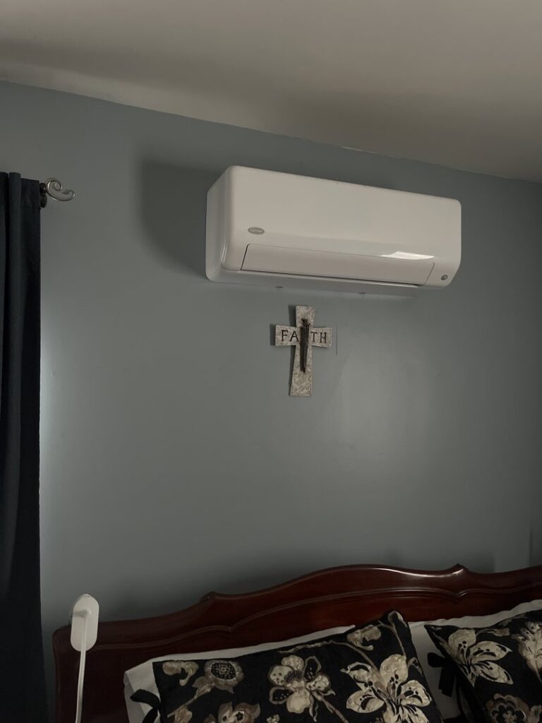 An indoor Carrier mini-split AC unit installed on a wall by Frank N Frank Mechanical Contractors in Rochester, NY.