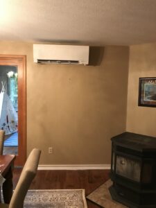 An indoor mini-split air conditioning unit installed in a living room by Columbia Heating & Air Conditioning in Kent, WA.