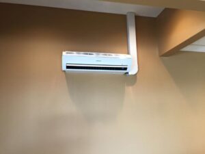 An indoor mini-split AC unit professionally installed on a wall by A&A HVAC and Electrical LLC in Nashville, TN.