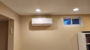 A newly installed indoor mini-split air conditioning unit on a wall by Ambiaire in Lakewood, NJ