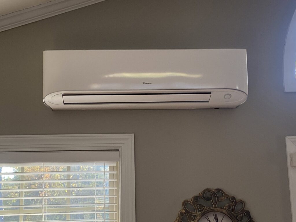 An indoor mini-split AC unit installed on a wall by Subzero Mechanical LLC Heating & Air in Concord, NC.