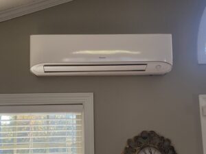 An indoor mini-split AC unit installed on a wall by Subzero Mechanical LLC Heating & Air in Concord, NC.