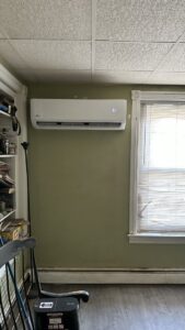 A newly installed indoor mini-split AC unit displaying 68 degrees on a wall by Alpine Pro Solutions in Allentown, PA.