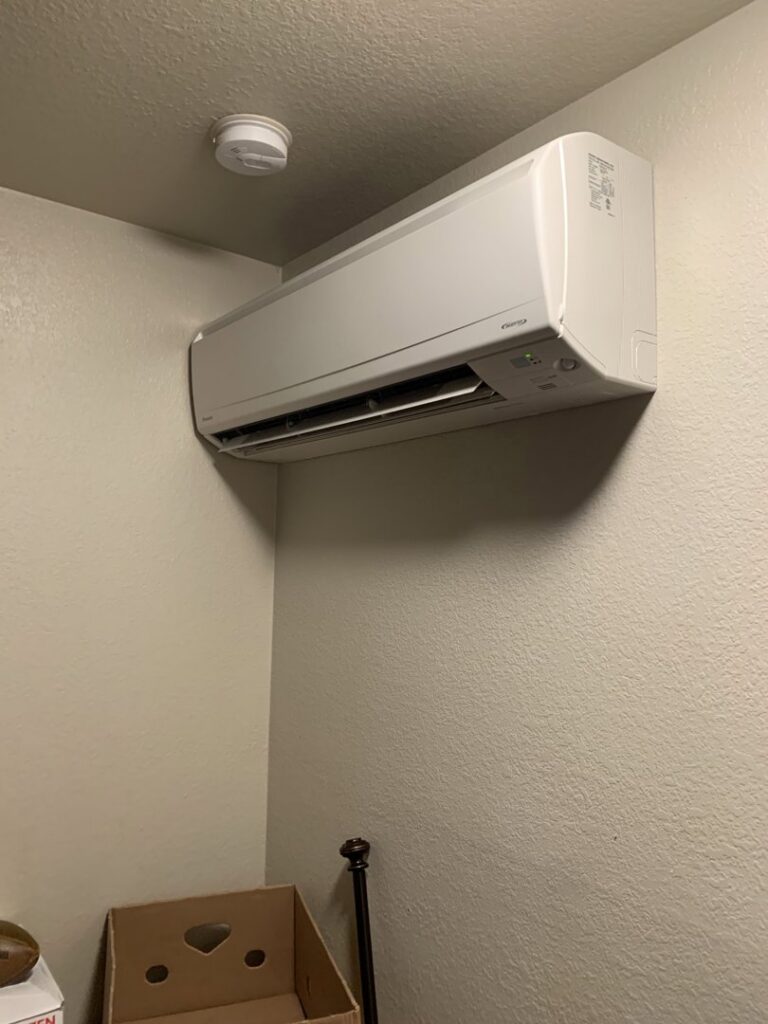 An indoor mini-split air handler unit installed on a wall by Finney Heating and Cooling LLC in Post Falls, ID.