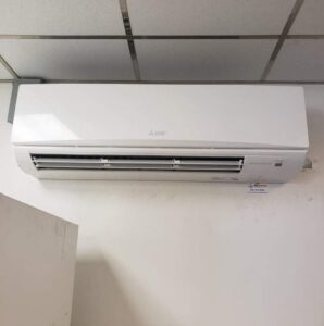 An indoor mini-split AC unit mounted on a ceiling by Air Energy Solutions in North Chesterfield, VA