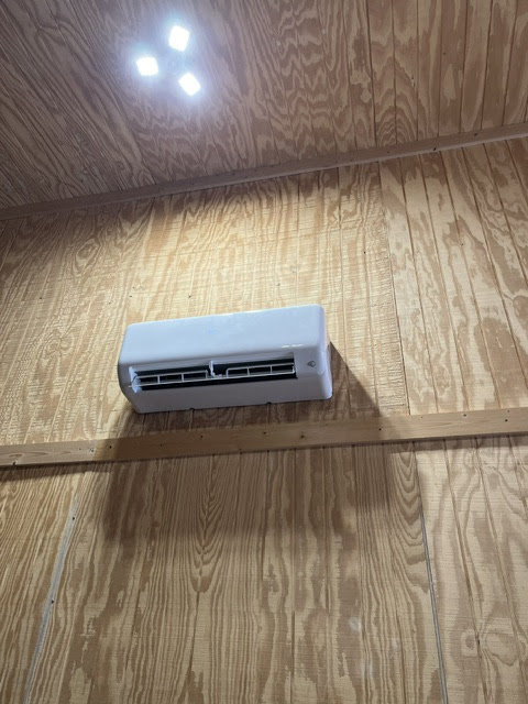An indoor mini-split head unit installed on a wooden wall by CHIN Flower HVAC LLC in Murfreesboro, TN.