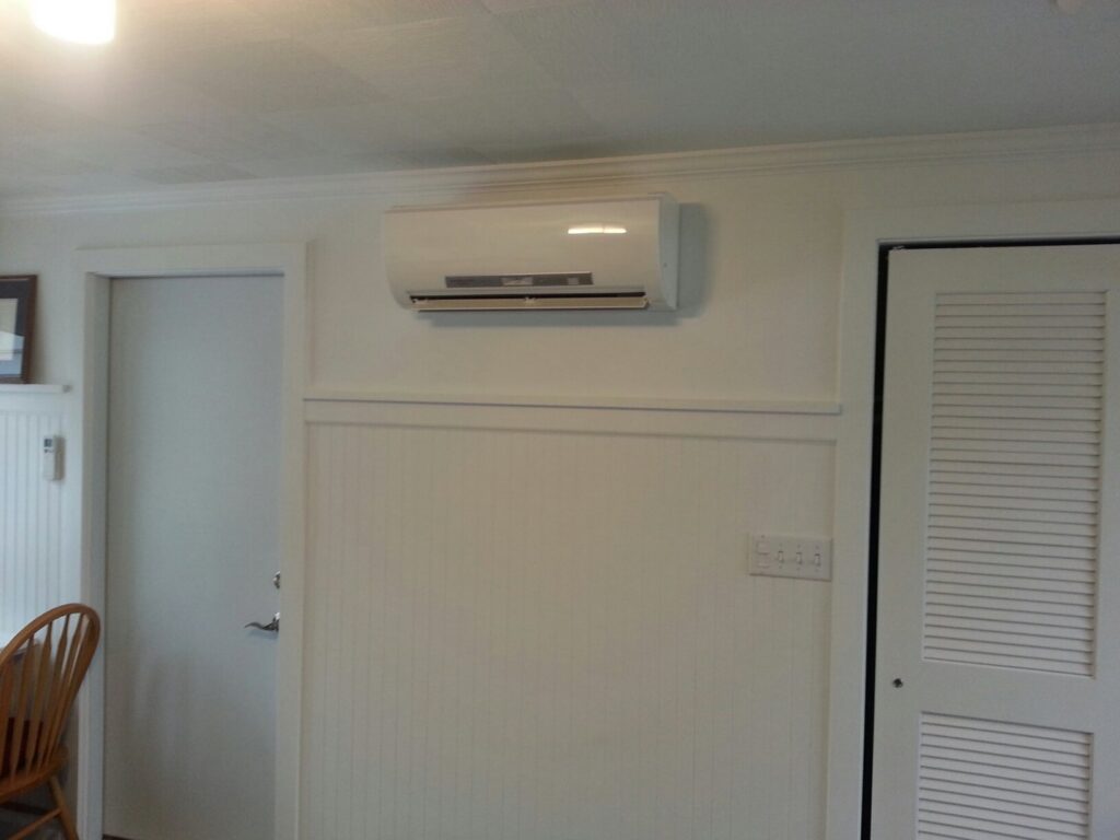 An indoor mini-split head unit installed on a wall for climate control by Custom Climates in Iowa City, IA.