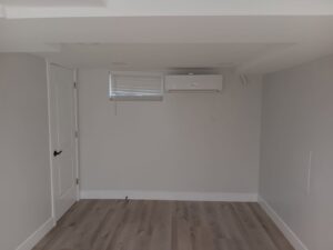 An indoor mini-split head unit installed on a wall in a room by LUCAS Heating And Air LLC in Salt Lake City, UT.