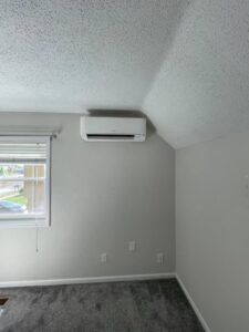 An indoor mini-split head unit installed on a wall by Pronto Air, an HVAC contractor in Olathe, KS.