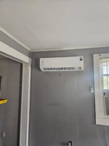 An indoor mini-split head unit installed on a wall by Southern Heating & A/C LLC in Mobile, AL.