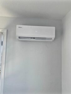 An indoor mini-split head unit installed on a wall by Thin Air Heating & Cooling Repair in Arvada, CO.
