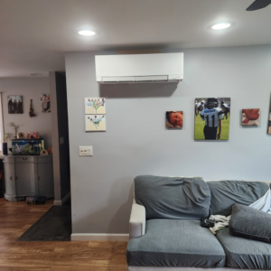 An indoor mini-split heat pump unit installed in a living room by Element Heat Pumps in Gray, ME.