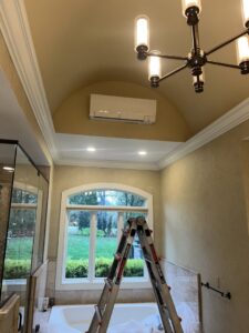 An indoor mini-split HVAC unit installed in a bathroom, ready for service by GrinHouse HVACR in La Grange, KY.