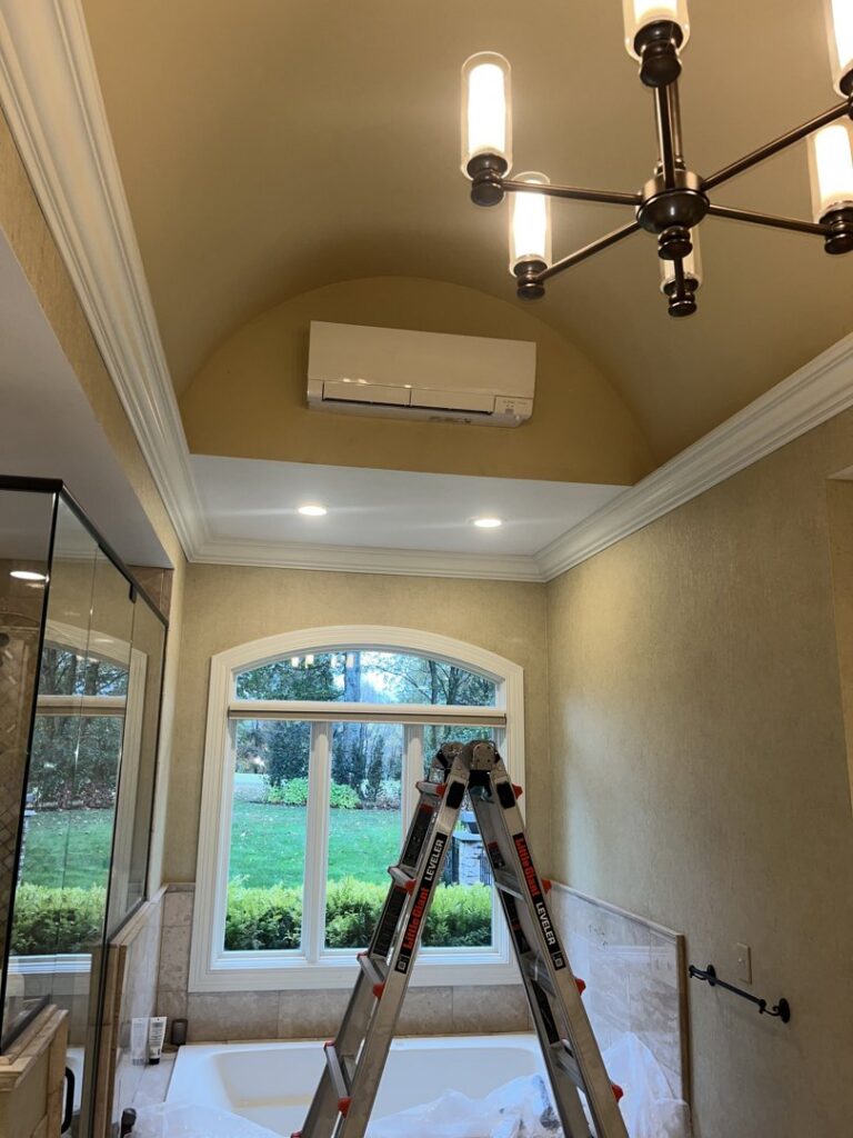 An indoor mini-split HVAC unit installed in a bathroom, ready for service by GrinHouse HVACR in La Grange, KY.