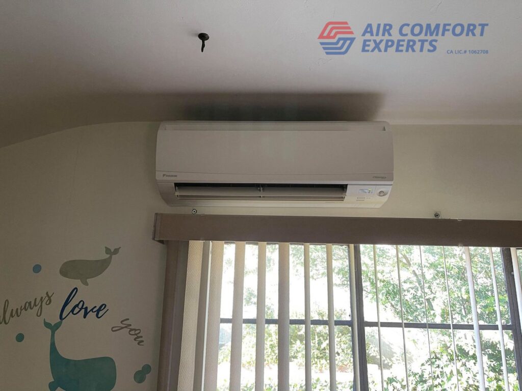 An indoor mini-split HVAC unit installed above a window by Air Comfort Experts in Pasadena, CA.