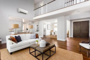 An indoor mini-split HVAC unit installed in a modern living room by Forever Mechanical INC. in Worcester, MA