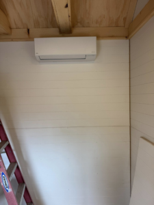 An indoor mini-split HVAC unit professionally installed on a wall by Vai Services in Wilmington, DE.