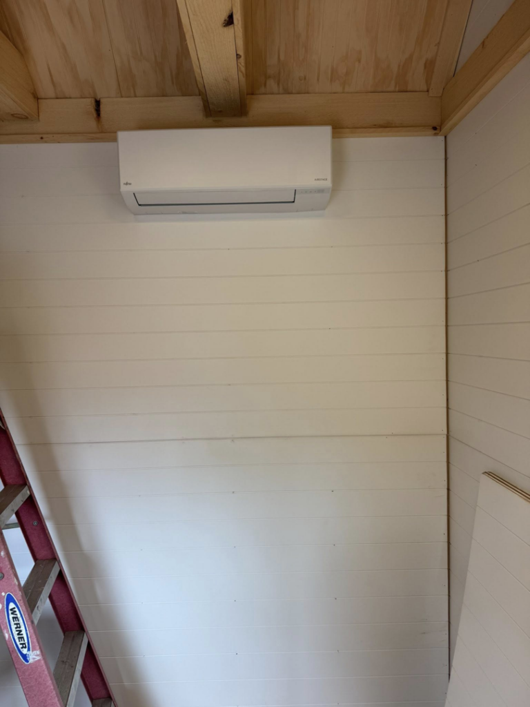 An indoor mini-split HVAC unit professionally installed on a wall by Vai Services in Wilmington, DE.