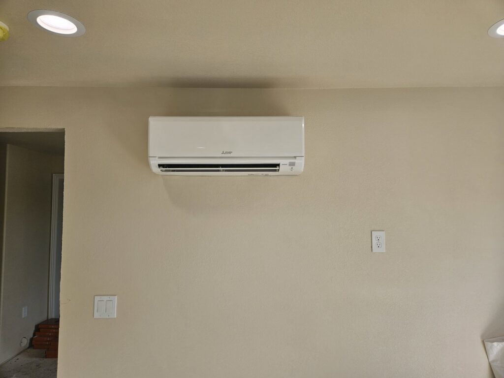 An indoor mini-split HVAC unit mounted on a wall by ABC Mechanical Inc in Lawrenceville, GA.