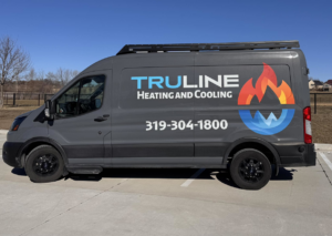 An indoor floor-standing mini-split unit installed in a sunroom, providing heating and cooling by TruLine HVAC in Cedar Rapids, IA.