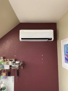 An indoor mini-split air conditioning unit installed on a wall by Desert Air, LLC in Sun Valley, NV.