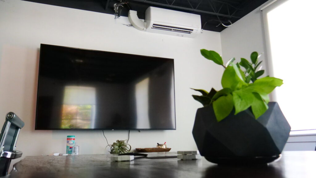 An indoor mini-split HVAC unit installed high on a wall by Eastergard HVAC in Greenville, SC.