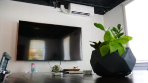 An indoor mini-split HVAC unit installed high on a wall by Eastergard HVAC in Greenville, SC.