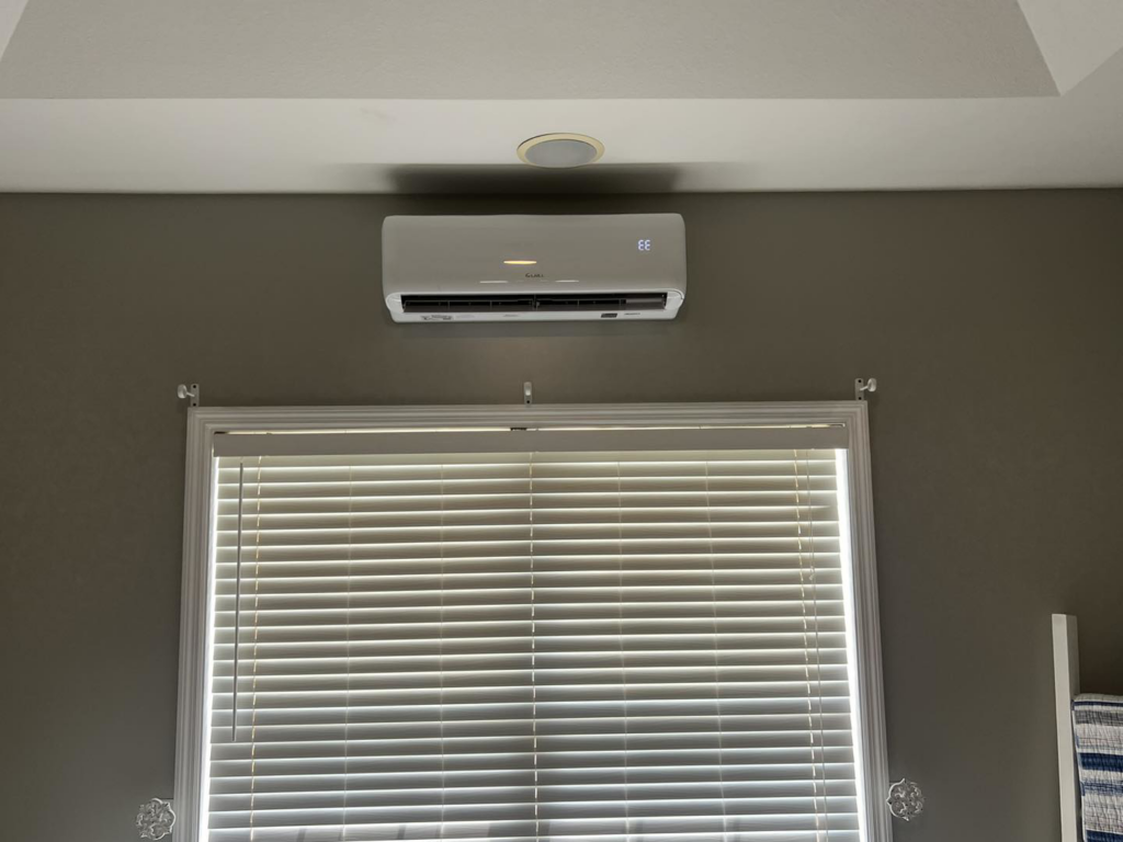 Indoor mini-split unit installed above a window by That Air Conditioning Company LLC in Dothan, AL