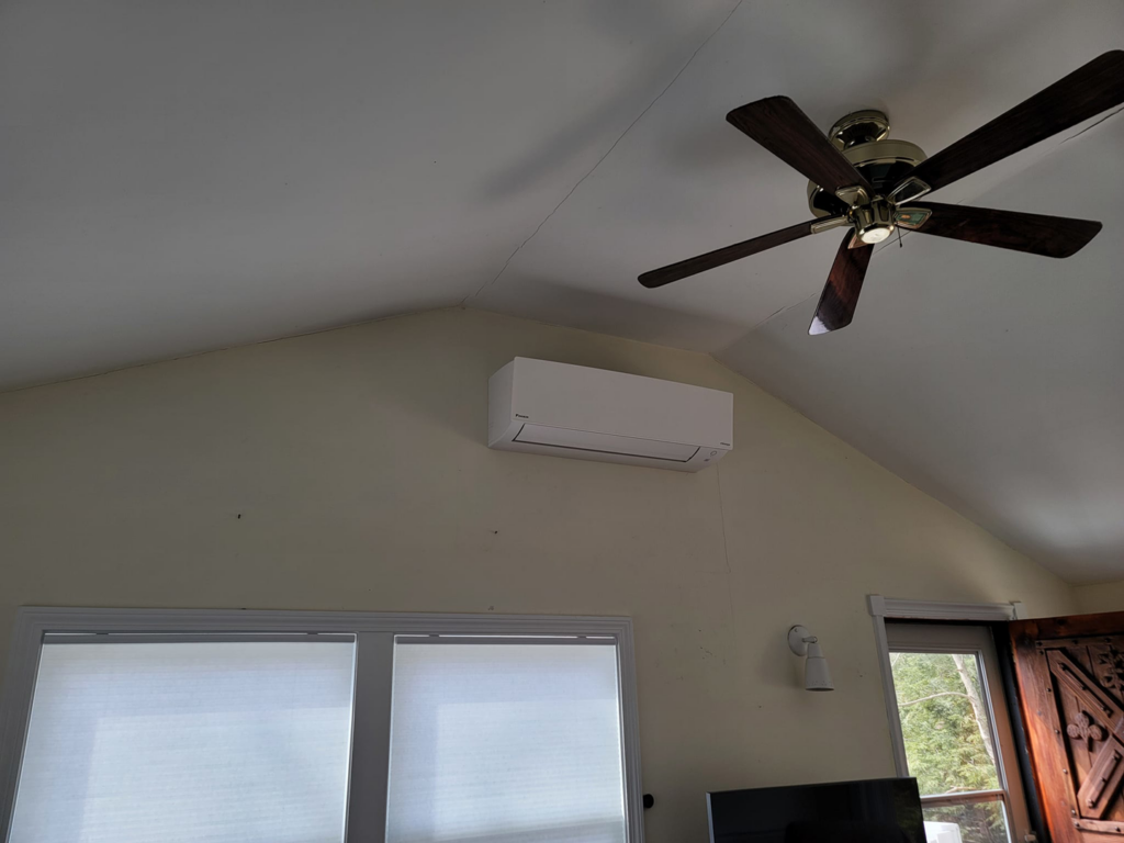 An indoor mini-split unit installed on a vaulted ceiling wall by Mini Split Solutions in Austin, TX