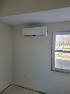 An indoor mini-split unit installed on a wall by Vega Heating and Cooling in Kansas City, KS