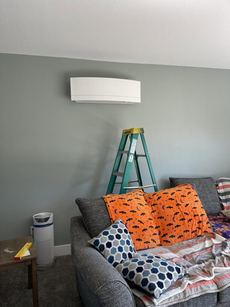 An indoor mini-split unit installation with a green ladder nearby by DiMartino's 5 Star Heating & Air Conditioning LLC in Salem, OR.