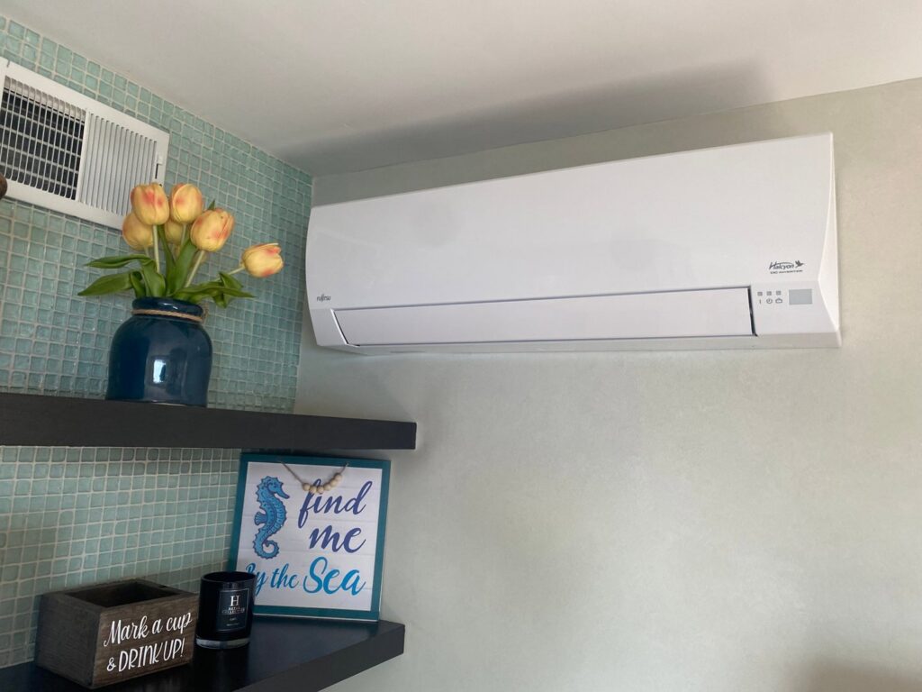 An indoor mini-split HVAC unit installed on a wall in a living area by Tom's Heating & Air Conditioning LLC in Lacey Township, NJ.