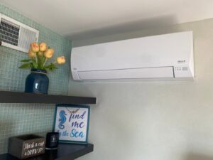 An indoor mini-split HVAC unit installed on a wall in a living area by Tom's Heating & Air Conditioning LLC in Lacey Township, NJ.