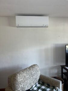 An indoor Mitsubishi mini-split HVAC unit installed in a residential room by KO HVAC Heating & Cooling in Kingston, PA.