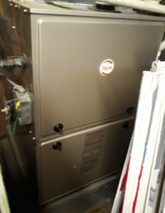 An indoor Payne furnace or air handler unit installed by W.N. Heating & Cooling, Inc in Worth, IL