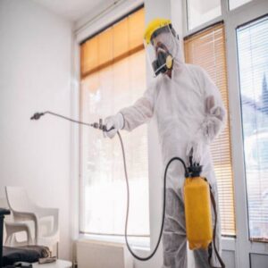 An indoor pest control treatment being performed by a technician for TOTAL Exterminating Co. Inc. in Indianapolis, IN.