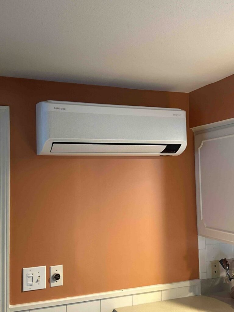 An indoor Samsung mini-split unit installed on a kitchen wall by Laird's HVAC in Auburn, ME.