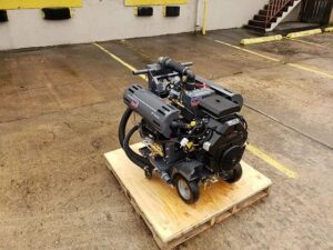 A powerful industrial carpet cleaning machine on a wooden pallet, used by Ype Cleaning LLC for professional services in Monroe, NC.