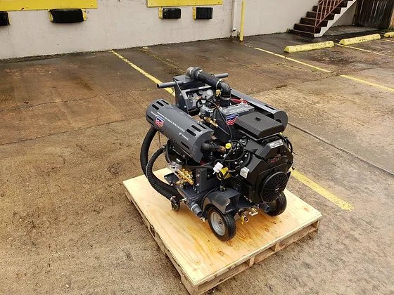 A powerful industrial carpet cleaning machine on a wooden pallet, used by Ype Cleaning LLC for professional services in Monroe, NC.