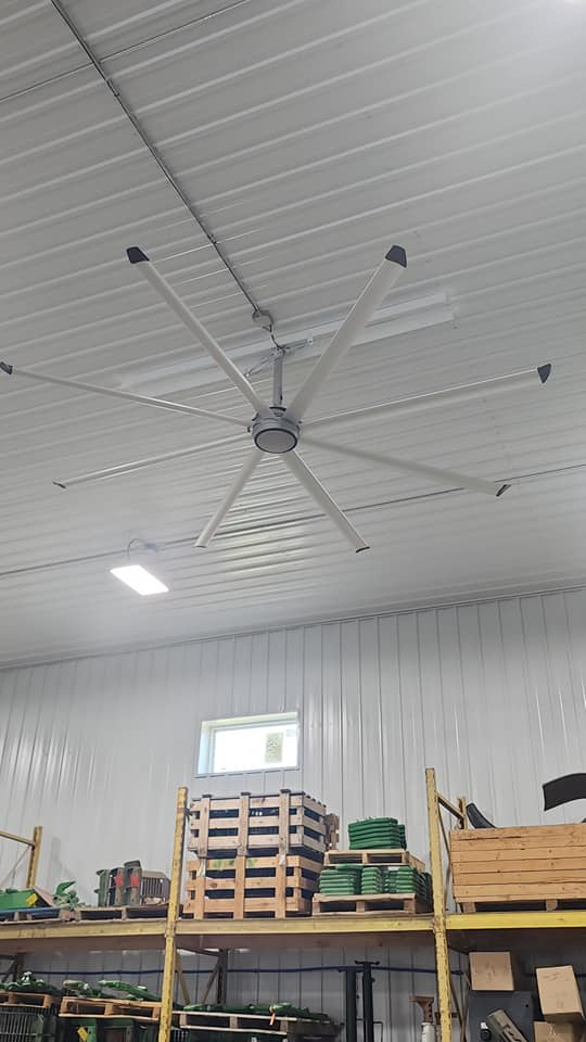 A large industrial ceiling fan installed in a commercial building by JC Electric, LLC in Huron, SD.