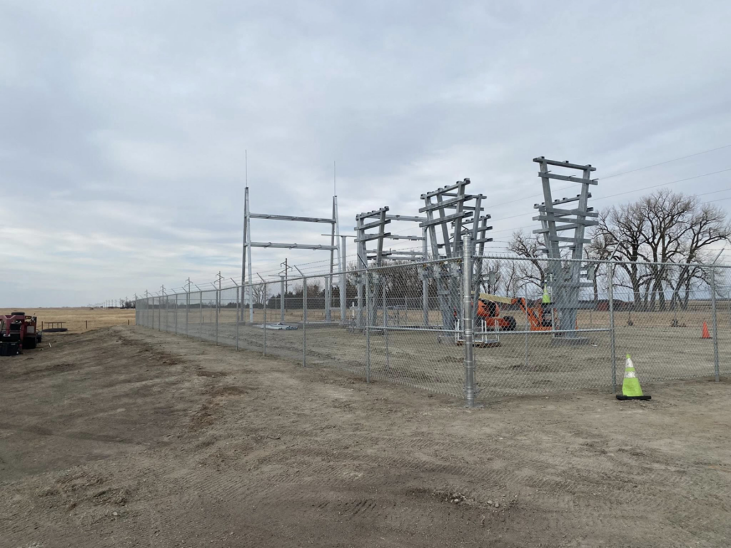 An industrial chain-link fence project with barbed wire completed by Big Red Fencing LLC in Waverly, NE.