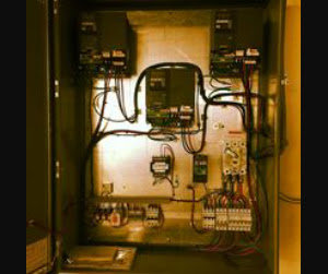 An industrial control panel with complex wiring and components, serviced by BR Electric in Newcastle, OK.