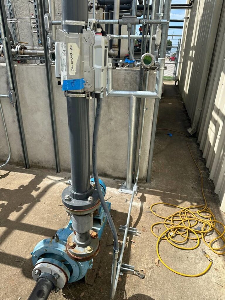 Industrial electrical conduit and wiring installed alongside machinery by Trizone Electric, LLC in Houston, TX.
