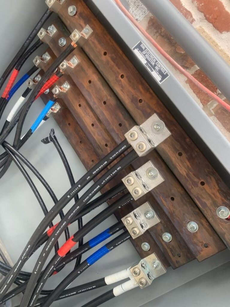 An industrial electrical control panel with complex wiring and components, serviced by A Renewable Electric LLC in Houston, TX.