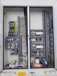 A large industrial electrical control panel with intricate wiring and components by Neptune Electric in Virginia Beach, VA.