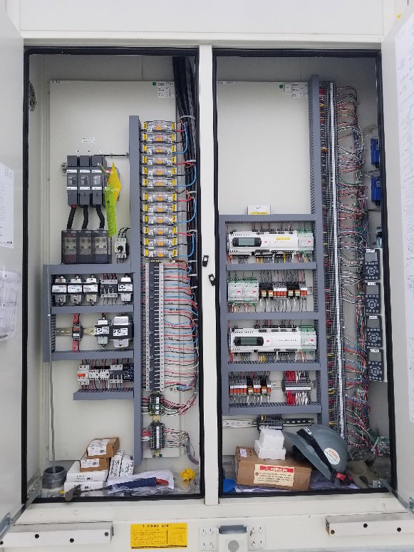 A large industrial electrical control panel with intricate wiring and components by Neptune Electric in Virginia Beach, VA.