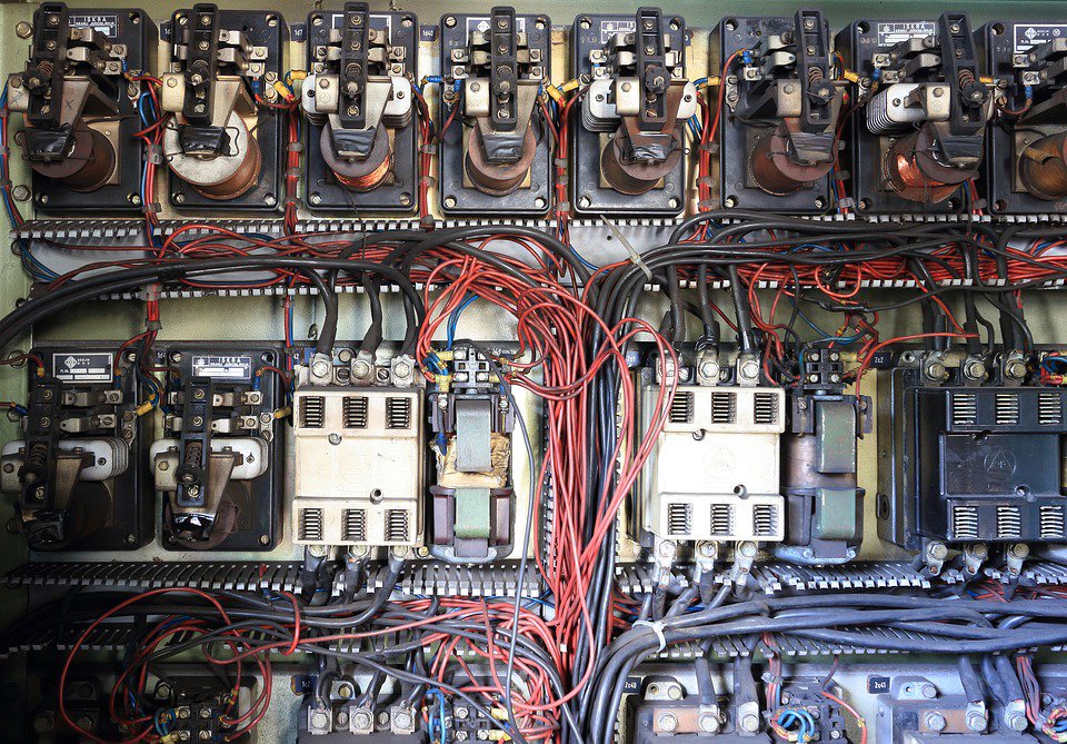 A complex industrial electrical control panel with extensive wiring, maintained by Thompson Electric in Elizabethtown, KY.