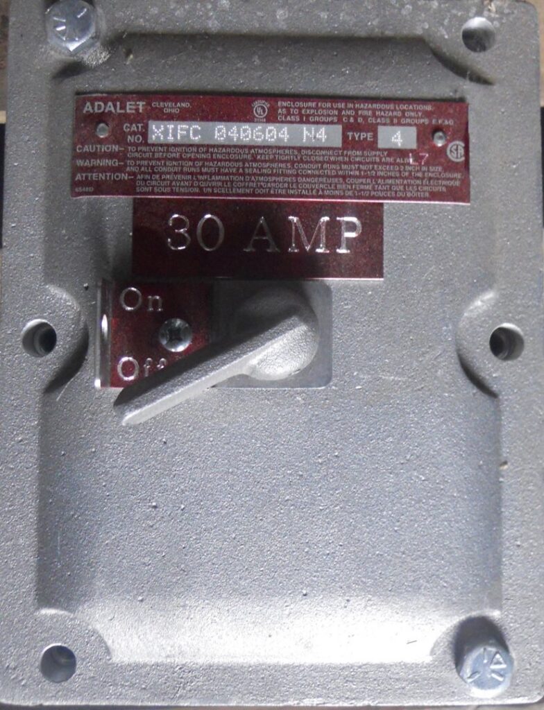 An industrial electrical disconnect switch labeled "30 AMP", a component used in electrician jobs by Basic Supply in Lafayette, LA.